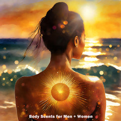 Woman faces the ocean at sunset. A large golden sun tattoo glows at her back